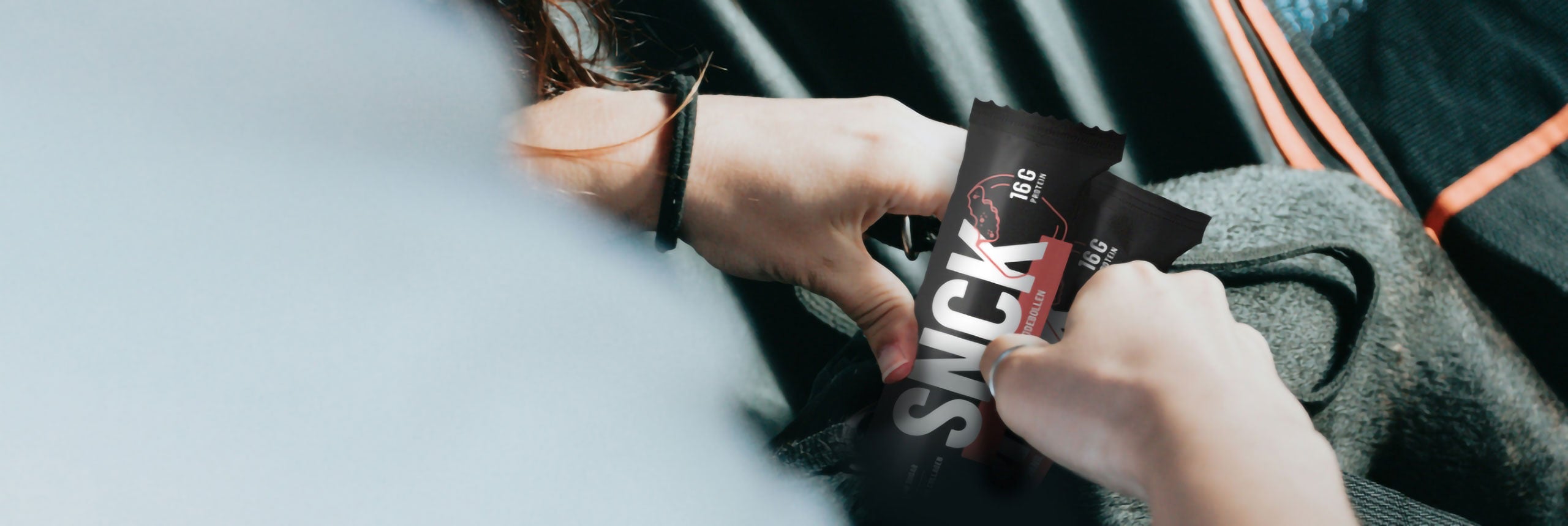 Person holding a two SNCK bars